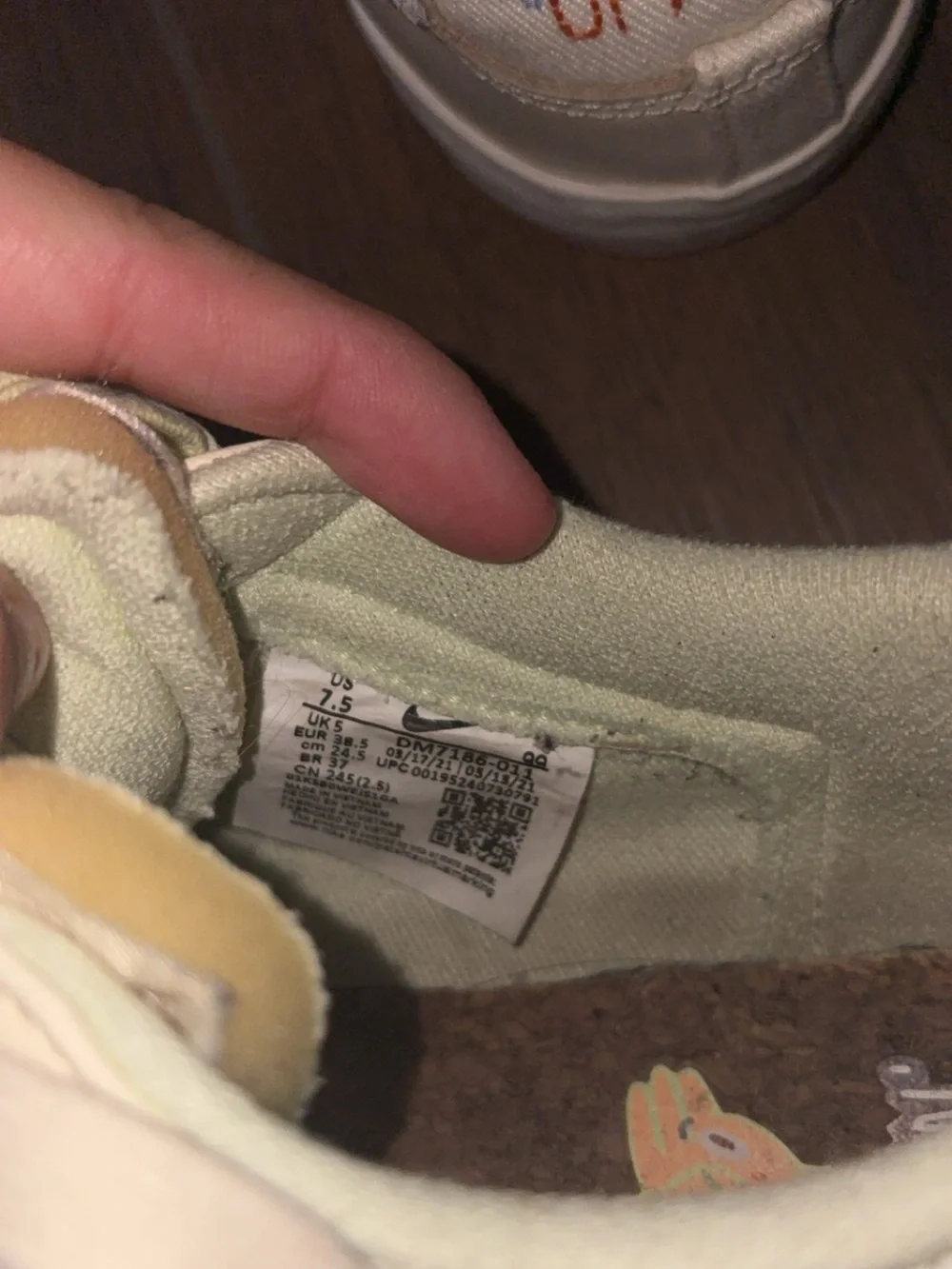 Nike Women's Low-Top Sneakers in Ivory with Pale Green Accents